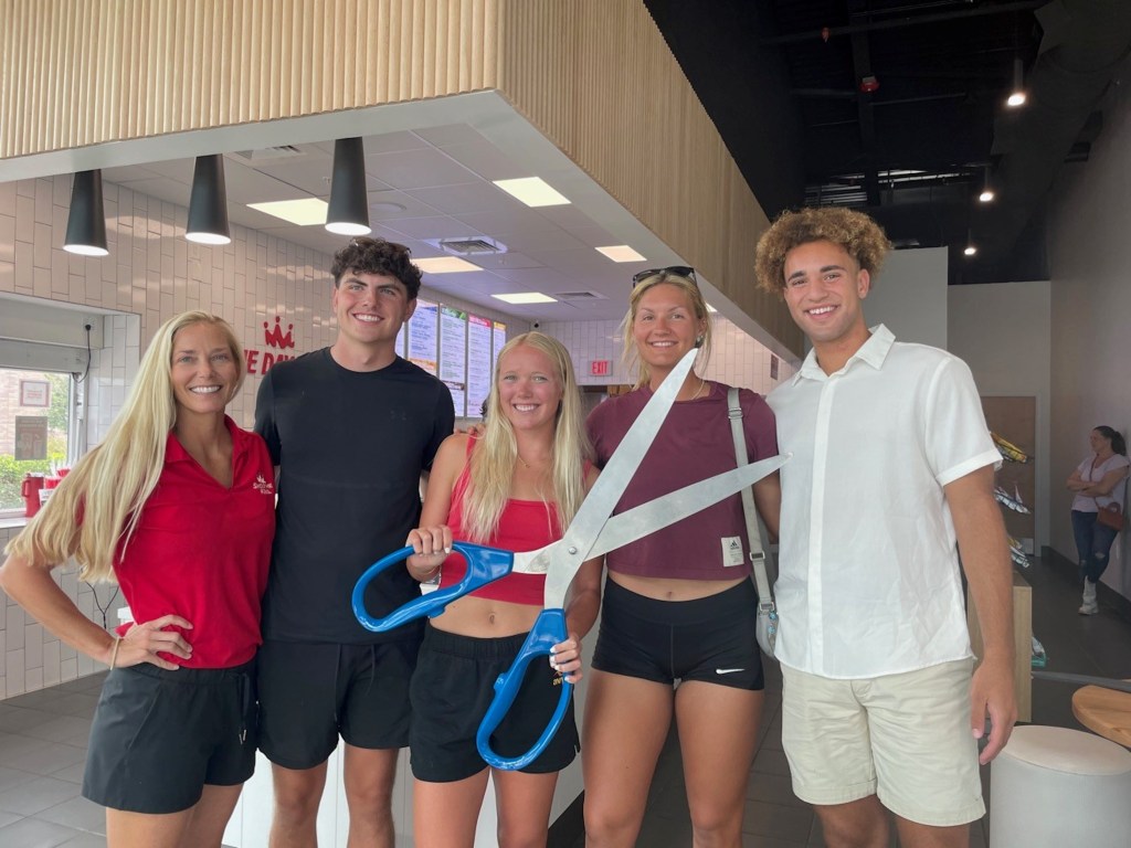 Grand opening ribbon cutting for the Smoothie King store that Pater (left) opened in April 2025. Credit: Lorraine Pater / Smoothie King 