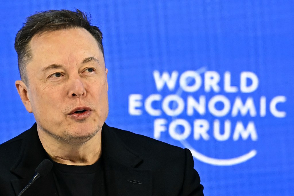 CEO of SpaceX and Tesla, South African-Canadian-US businessman Elon Musk speaks during the World Economic Forum (WEF) annual meeting in Davos on January 22, 2026. The World Economic Forum takes place in Davos from January 19 to January 23, 2026. (Photo by Fabrice COFFRINI / AFP)