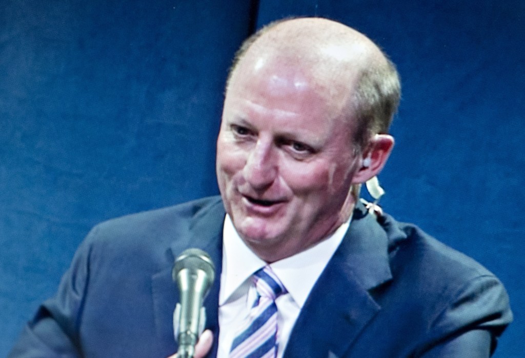 Greg Abel, chairman and chief executive officer of Berkshire Hathaway Energy Co., speaks during the virtual Berkshire Hathaway annual shareholders meeting seen on a laptop computer in Arlington, Virginia, U.S., on Monday, May 4, 2020. Spaced apart from Warren Buffett on stage during the live-streamed annual meeting, deputy Abel spent more time than usual fielding shareholder questions on topics ranging from how Berkshire's businesses are handling the pandemic to opportunities for lending deals. Photographer: Andrew Harrer/Bloomberg